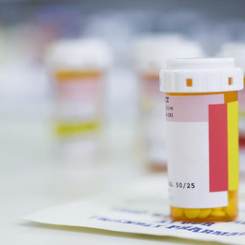 Pill bottles on a prescription pad