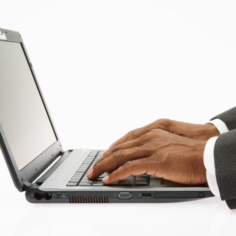 Hands on a laptop